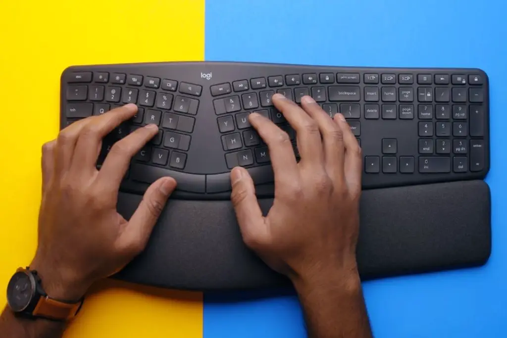 Black Ergonomic Keyboard with a Wrist Pad.