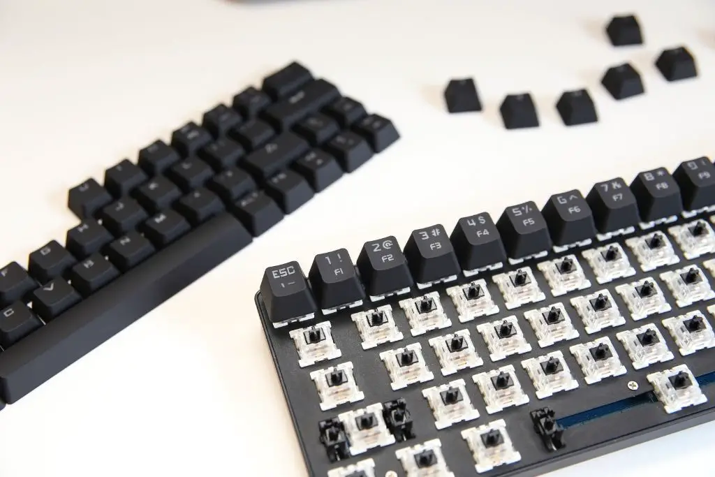Keycaps removed from Mechanical Keyboard with black switches.