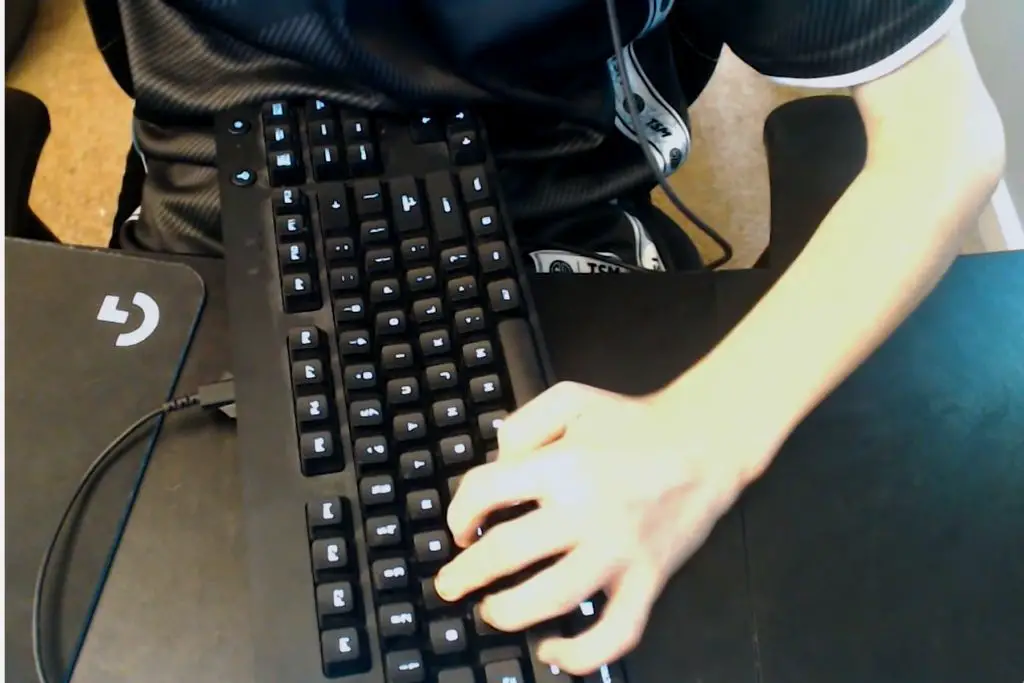 Professional Gamer is playing a game with a tilted keyboard.