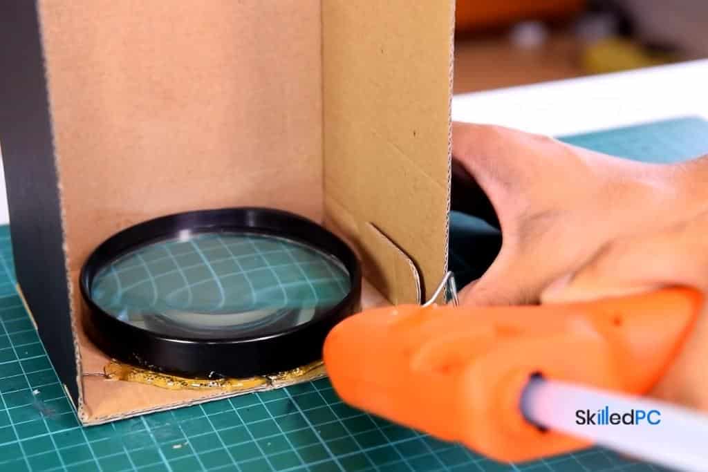 I am mounting magnifying glass within the box with glue.